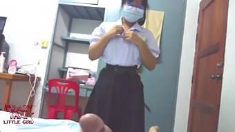 A Beautiful Thai Student With Glass And Glass Glasses Is Having Sex.